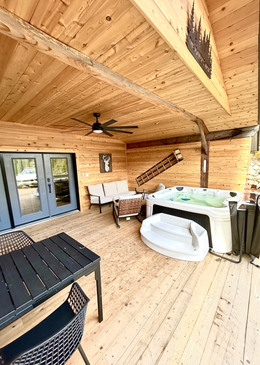 The private covered deck and hot tub at Ravens Nest